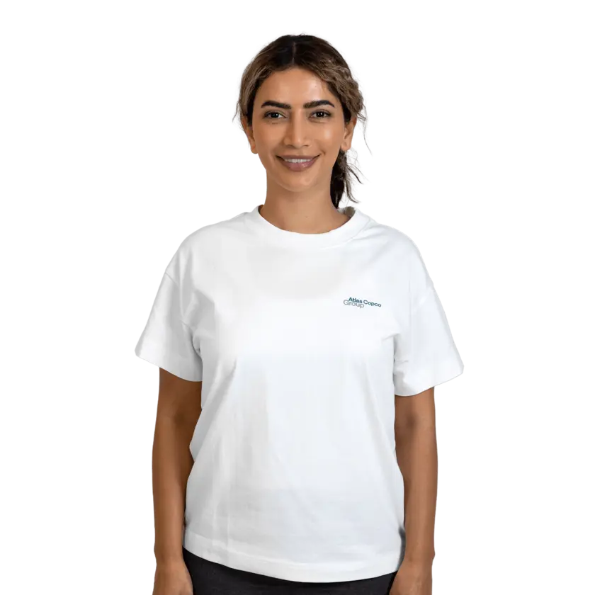 woman wearing white tshirt with atlas copco group logo
