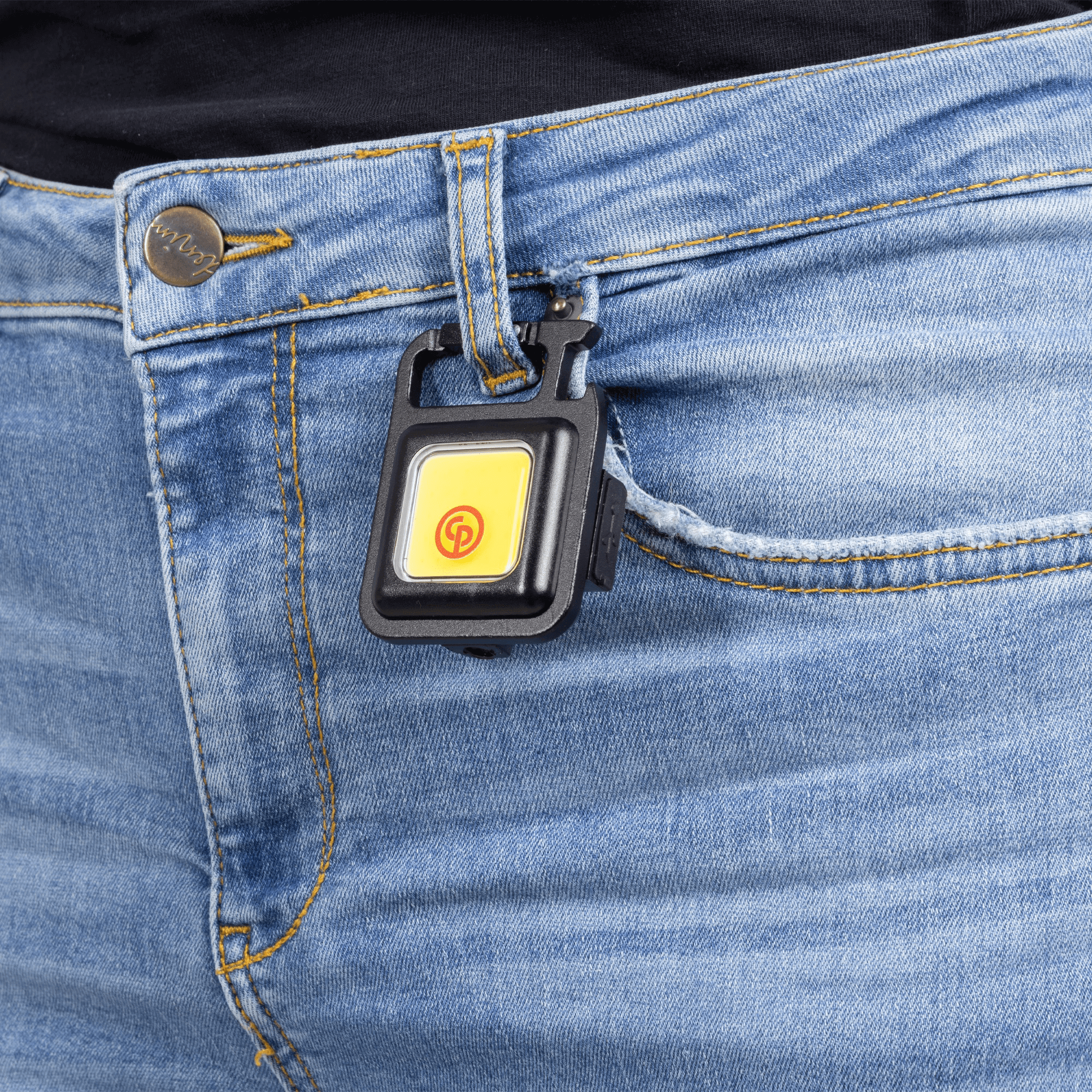 black mini flashlight with chicago pneumatic logo in red hanging in pants