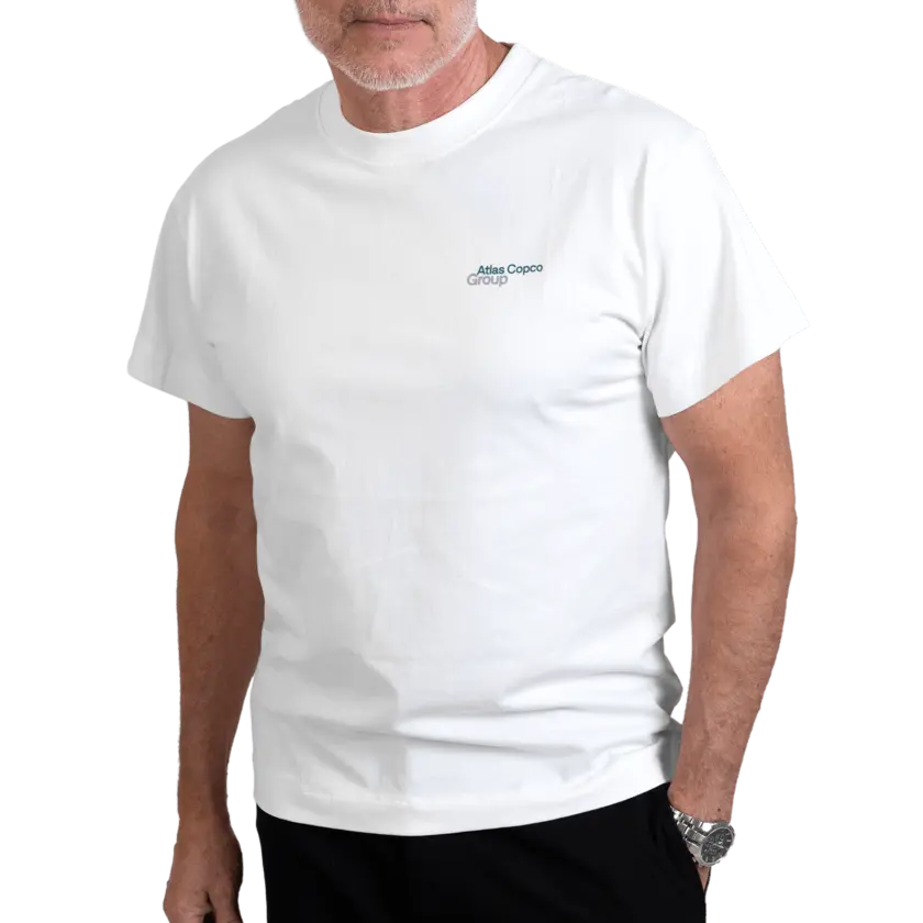 man wearing white tshirt with atlas copco group logo