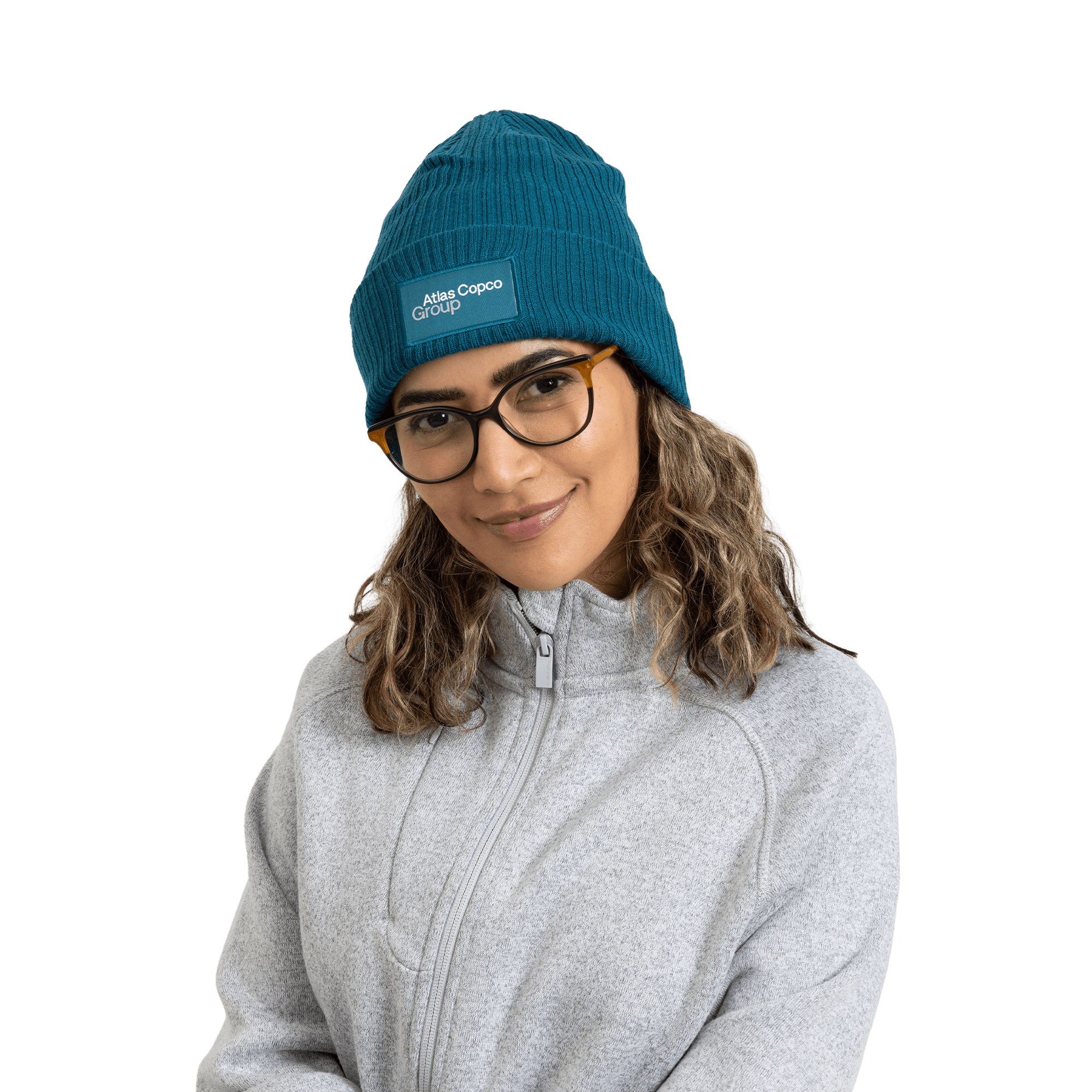 woman wearing teal winter hat with atlas copco group logo