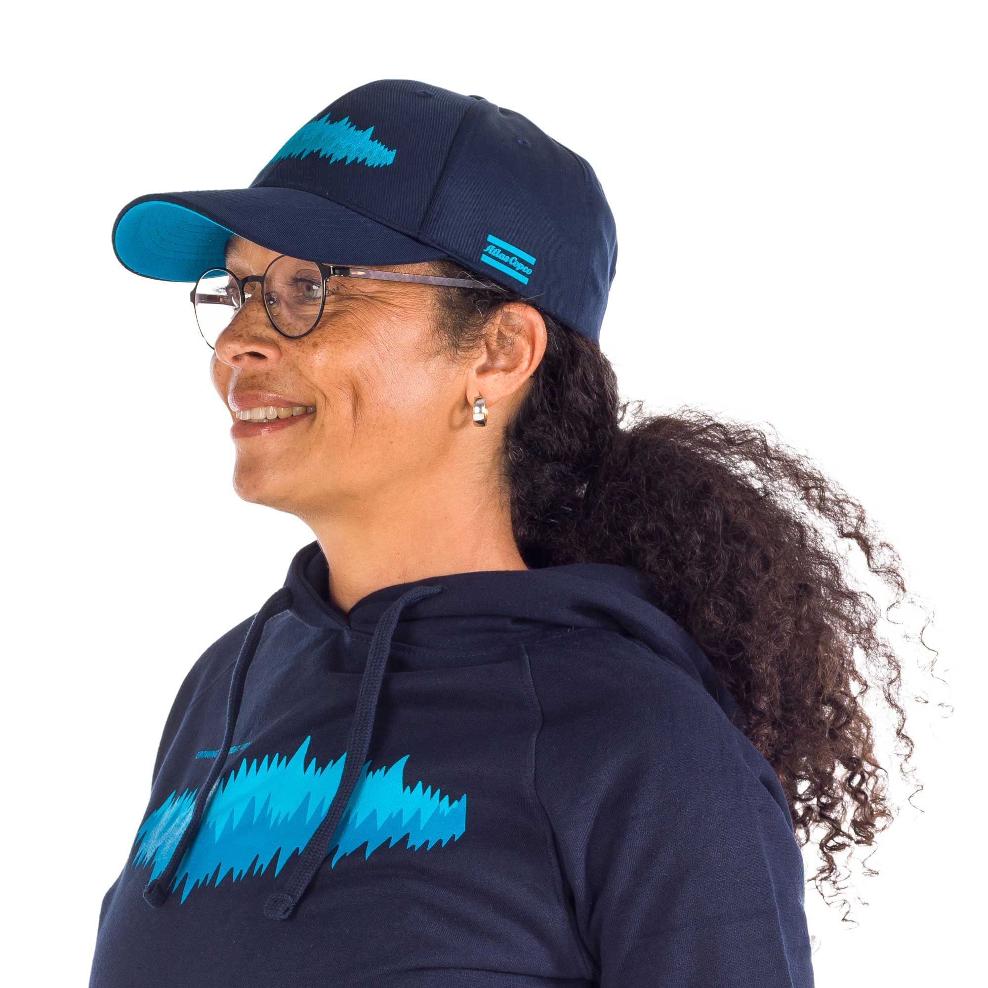 navy cap with gtrw pattern and atlas copco logo on female model